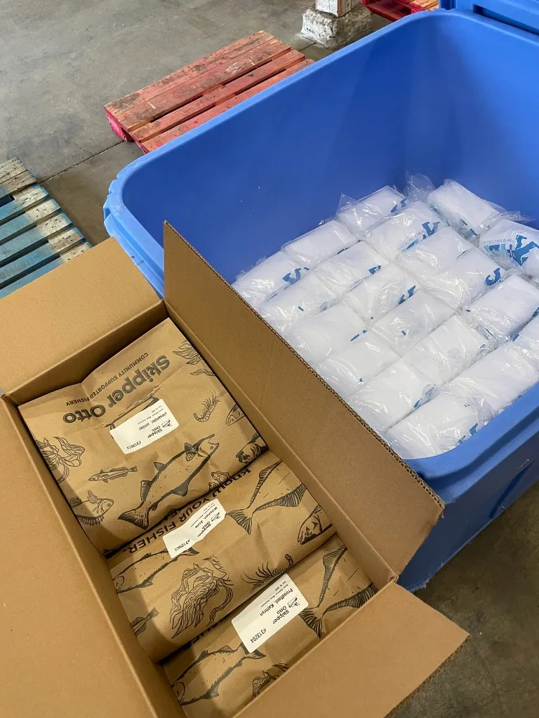 Skipper Otto seafood packages being packed into an insulated shipping box with ice packs at the F2C warehouse